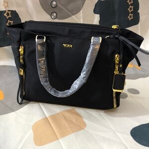 Tumi Black and Gold Tote with Gold Accents